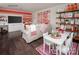 Playroom with sectional sofa, colorful art, and built-in shelving at 9130 Dulwich Dr # Ken0079, Charlotte, NC 28215