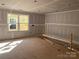 Unfinished room with sealed drywall and a window, awaiting its final touches and customizations at 9130 Dulwich Dr # Ken0079, Charlotte, NC 28215