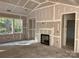 Open living space with drywall, ready for finishing, featuring bright natural light and fireplace at 9130 Dulwich Dr # Ken0079, Charlotte, NC 28215