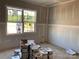 Unfinished room with drywall and a large window, awaiting customization and finishing touches at 9130 Dulwich Dr # Ken0079, Charlotte, NC 28215