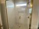Beautiful tiled walk-in shower with glass doors and a built-in niche, complete with stylish fixtures at 9130 Dulwich Dr # Ken0079, Charlotte, NC 28215