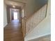 Beautiful staircase with wood treads and white risers, leading to the upper level of the home at 9130 Dulwich Dr # Ken0079, Charlotte, NC 28215
