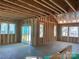 Interior framing of a home under construction with visible windows and sliding doors at 9130 Dulwich Dr # Ken0079, Charlotte, NC 28215