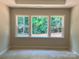 Window with a view of the lush green outdoors at 9130 Dulwich Dr # Ken0079, Charlotte, NC 28215