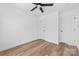 Bedroom featuring a modern ceiling fan, vinyl flooring, and white doors at 1097 Georgetown Rd, Lincolnton, NC 28092