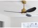 A stylish black and gold ceiling fan graces a modern interior, blending function and design at 1097 Georgetown Rd, Lincolnton, NC 28092