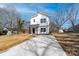 Charming two-story home with vertical siding and a concrete driveway at 1097 Georgetown Rd, Lincolnton, NC 28092