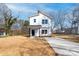 Charming two-story home with vertical siding and a concrete driveway at 1097 Georgetown Rd, Lincolnton, NC 28092