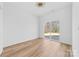 Spacious living room with light wood floors and sliding glass doors to a back patio at 1097 Georgetown Rd, Lincolnton, NC 28092