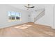 Open-concept living space with wood floors and staircase at 1097 Georgetown Rd, Lincolnton, NC 28092