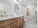 Updated bathroom featuring a double vanity, marble shower, and gold accents at 201 Seneca Pl, Charlotte, NC 28210