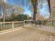 Spacious deck with seating area, overlooking a wooded backyard at 201 Seneca Pl, Charlotte, NC 28210