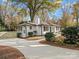 Curved driveway leading to charming white home at 201 Seneca Pl, Charlotte, NC 28210