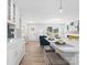 Modern kitchen with white cabinets, quartz countertops, and an island at 201 Seneca Pl, Charlotte, NC 28210