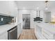 Modern kitchen with white cabinets, stainless steel appliances, and quartz countertops at 201 Seneca Pl, Charlotte, NC 28210