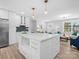 Modern kitchen with white cabinets, quartz countertops and breakfast bar at 201 Seneca Pl, Charlotte, NC 28210