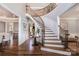 Elegant entryway with a curved staircase and hardwood floors at 3014 Highbury Pl, Weddington, NC 28104