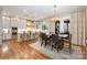 Gourmet kitchen with white cabinets, a large island, and high-end appliances at 3014 Highbury Pl, Weddington, NC 28104