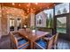 Screened porch with brick details, dining table, and string lights at 3014 Highbury Pl, Weddington, NC 28104