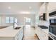 Open kitchen with white cabinets and quartz countertops at 4481 Doyle Ridge Rd, Maiden, NC 28650