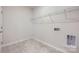 Bright laundry room with tile floor, shelving and hookups at 4481 Doyle Ridge Rd, Maiden, NC 28650