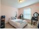 Bedroom with cow print wall and neutral colored bedding at 507 Texas Trl, Dallas, NC 28034