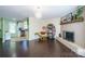 Living room features a fireplace, built-in shelving, and dark hardwood floors at 507 Texas Trl, Dallas, NC 28034