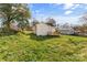 Expansive backyard view, featuring a wooden deck and complemented by vibrant green grass at 612 E E St, Newton, NC 28658