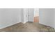 Neutral bedroom with soft carpeting and a double door closet at 612 E E St, Newton, NC 28658