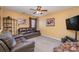 Bonus room with leather sofas and a large TV at 7546 Lady Liberty Ln, Charlotte, NC 28217