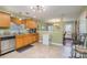 Eat-in kitchen with stainless steel appliances and wood cabinets at 7546 Lady Liberty Ln, Charlotte, NC 28217