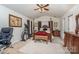 Main bedroom with a ceiling fan, king-size bed, and a dresser at 7546 Lady Liberty Ln, Charlotte, NC 28217