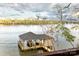 Private boathouse on the lake with covered dock at 8058 Edgewater Dr, Norwood, NC 28128