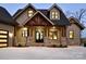 Lakefront home with stone and wood accents at 8058 Edgewater Dr, Norwood, NC 28128