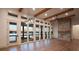 Open living area with hardwood floors, stone fireplace, and lake views at 8058 Edgewater Dr, Norwood, NC 28128