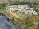 Aerial view of houses and community near a lake at 2033 White Cypress Ct # Kh06, Charlotte, NC 28216