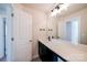 Modern bathroom with a vanity, sink, and large mirror at 2033 White Cypress Ct # Kh06, Charlotte, NC 28216