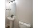 Simple bathroom with pedestal sink and black fixtures at 2033 White Cypress Ct # Kh06, Charlotte, NC 28216