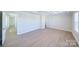 Bright bedroom with wood-look floors and access to other rooms at 2033 White Cypress Ct # Kh06, Charlotte, NC 28216