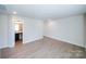 Large bedroom with wood-look floors and access to a bathroom at 2033 White Cypress Ct # Kh06, Charlotte, NC 28216