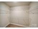 Large closet with wire shelving; offers ample storage space at 2033 White Cypress Ct # Kh06, Charlotte, NC 28216