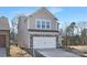 Two-story house with stone and shingle accents, two-car garage, and landscaping at 2033 White Cypress Ct # Kh06, Charlotte, NC 28216