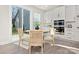 Kitchen nook with table and chairs, and sliding doors leading to the backyard at 2033 White Cypress Ct # Kh06, Charlotte, NC 28216