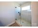 Clean shower with glass enclosure and tile surround at 2033 White Cypress Ct # Kh06, Charlotte, NC 28216