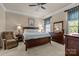 Spacious main bedroom boasts a ceiling fan, carpeting, and coordinating furnishings at 3006 Cricket Ln, Lancaster, SC 29720