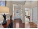 Well-lit foyer showcases hardwood floors, wainscoting, and an archway leading into a bedroom at 3006 Cricket Ln, Lancaster, SC 29720