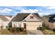 Charming single-Gathering home with a well-maintained lawn, attached garage, and inviting entrance at 3006 Cricket Ln, Lancaster, SC 29720