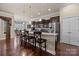 Beautiful kitchen featuring dark wood cabinets, granite countertops, a large island, and stainless steel appliances at 3006 Cricket Ln, Lancaster, SC 29720