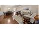 Inviting living room featuring hardwood floors, neutral tones, and an open dining area with elegant furnishings at 3006 Cricket Ln, Lancaster, SC 29720