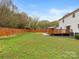 Private backyard with expansive lawn and wood fence at 3417 Chilham Pl, Charlotte, NC 28226